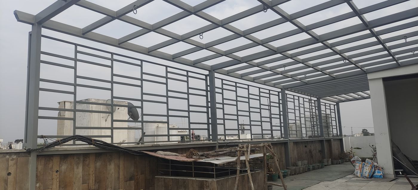 Grey pergola with grill privacy walls